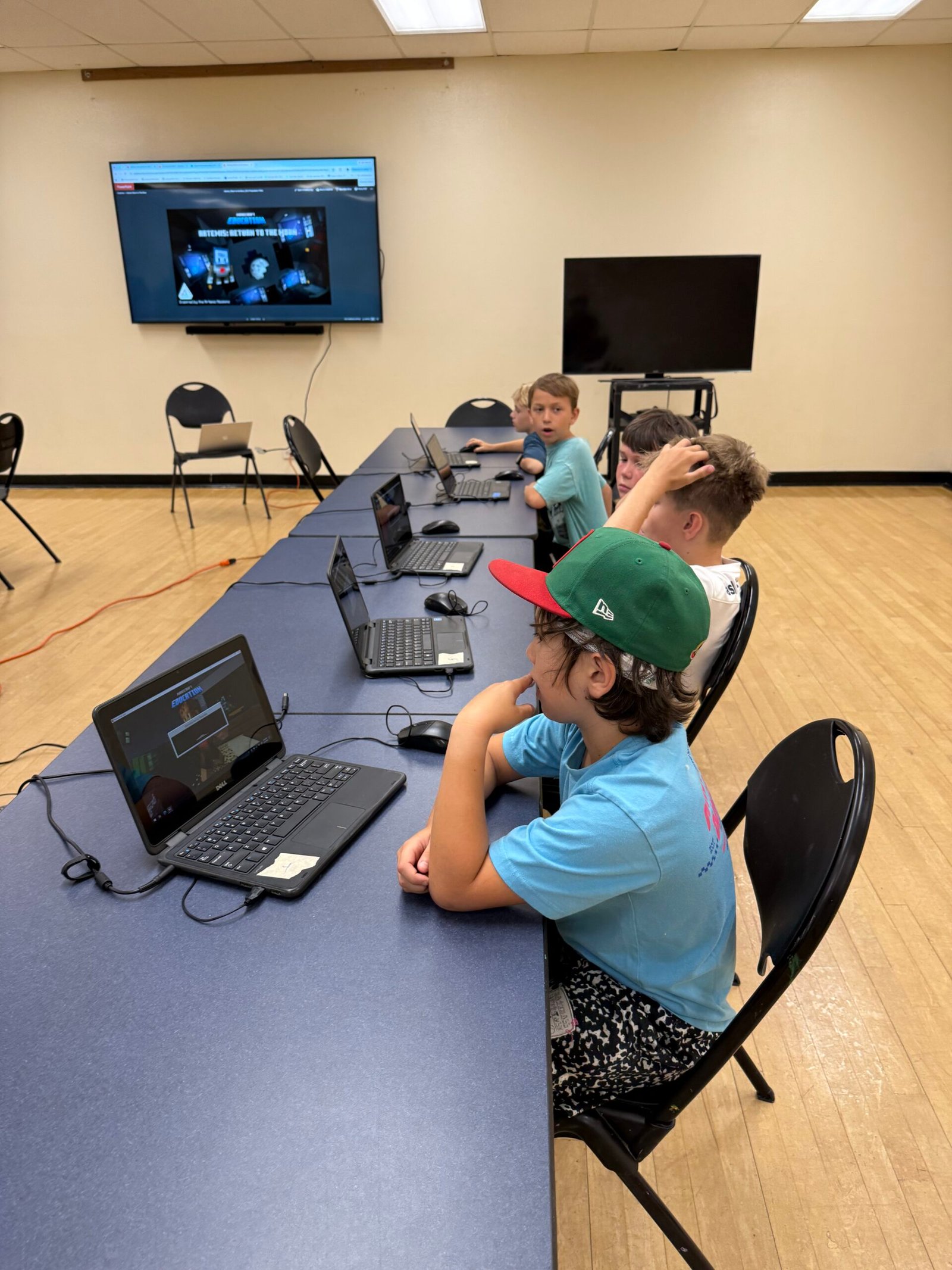 Explore Planets in Minecraft! (7-14)Embark on an official NASA-inspired space adventure! Powered by Microsoft’s Minecraft Education and created in partnership with NASA and the Challenger Center, students use computer science to build Artemis rockets, program Orion space capsules, configure Mission Control, and construct sustainable moon bases on the lunar surface.Program Highlights:
Space & Planetary Exploration — Code space stations, pilot rovers, and explore solar systems inside Minecraft Education.
Block-Based Automation — Write code to build bases, harvest resources, and construct 3D space structures.
3D Spatial & Engineering Logic — Program coordinates, loops, and conditional code to master 3D geometry.
Collaborative Problem Solving — Team up on space missions and debug code together in secure multiplayer worlds.
Real-World Coding Concepts — Bridge favorite gameplay with core computer science to prepare for languages like Python.
CSTA, NGSS & STEM Aligned — Powered by Microsoft Education and mapped to CSTA CS and NGSS Earth & Space standards.Ideal for: Curious kids who love Minecraft, building, and discovering how code powers the world around them!